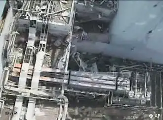 In this April 21, 2011 image from a video footage taken by T-Hawk drone aircraft and released, Wednesday, April 27, 2011 by Tokyo Electric Power Co. (TEPCO), the aerial image shows north side of the damaged reactor building of Unit 1 at the Fukushima Dai-ichi nuclear power plant in Okuma town, Fukushima Prefecture, northeastern Japan. (AP Photo/Tokyo Electric Power Co.) EDITORIAL USE ONLY