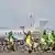 Climate activists on bikes protest against environmental pollution from aviation at Amsterdam's Schiphol Airport