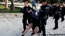 Israeli border police detain a Palestinian woman at the Al-Aqsa compound, also known to Jews as the Temple Mount, while tension arises during clashes with Palestinians in Jerusalem's Old City, April 5, 2023. REUTERS/Ammar Awad 