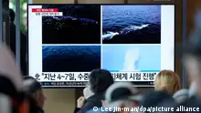 A TV screen shows a recent combination of images released by Pyongyang's official Korean Central News Agency during a news program at the Seoul Railway Station in Seoul, South Korea, Saturday, April 8, 2023. North Korea on Saturday claimed it tested this week a second known type of nuclear-capable underwater attack drone designed to destroy naval vessels and ports, adding to a flurry of weapons demonstrations this year that have heightened tensions with rivals. (AP Photo/Lee Jin-man)
