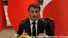 French President Emmanuel Macron gestures as he speaks during a joint meeting of the press with Chinese President Xi Jinping at the Great Hall of the People in Beijing, Thursday, April 6, 2023. (AP Photo/Ng Han Guan, Pool)
