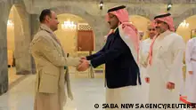 The head of the Houthi Supreme Political Council, Mahdi al-Mashat, shakes hands with Saudi ambassador to Yemen Mohammed Al-Jaber at the Republican Palace in Sanaa, Yemen April 9, 2023. Saba News Agency /Handout via REUTERS ATTENTION EDITORS - THIS IMAGE WAS PROVIDED BY A THIRD PARTY. 