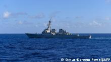 This handout photo from the US Navy taken on November 20, 2021 shows the US Navy's Arleigh Burke-class guided-missile destroyer USS Milius (DDG 69) sailing in the South China Sea. - China simulated sealing off Taiwan during a third day of wargames around the self-ruled island on April 10, 2023, as the United States deployed a naval destroyer into Beijing-claimed waters in a show of force. (Photo by Omar-Kareem Powell / US NAVY / AFP) / RESTRICTED TO EDITORIAL USE - MANDATORY CREDIT AFP PHOTO/US NAVY/OMAR-KAREEM POWELL - NO MARKETING NO ADVERTISING CAMPAIGNS - DISTRIBUTED AS A SERVICE TO CLIENTS