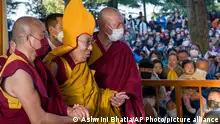 March 7, 2023.**Tibetan spiritual leader the Dalai Lama in a ceremonial yellow hat arrives at the Tsuglakhang temple to give a sermon in Dharamshala, India, Tuesday, March 7, 2023. Tibetan spiritual leader Dalai Lama apologized Monday after a video showing him kissing a child on the lips provoked outrage.(AP Photo/Ashwini Bhatia,file)
