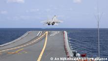 09/04/2023 In this photo released by Xinhua News Agency, a J-15 Chinese fighter jet takes off from the Shandong aircraft carrier during the combat readiness patrol and military exercises around the Taiwan Island by the Eastern Theater Command of the Chinese People's Liberation Army (PLA) on Sunday, April 9, 2023. China's military declared Monday it is ready to fight after completing three days of large-scale combat exercises around Taiwan that simulated sealing off the island in response to the Taiwanese president's trip to the U.S. last week. (An Ni/Xinhua via AP)