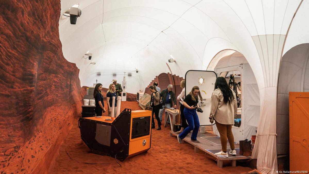Media representatives at a press event in the NASA simulation house