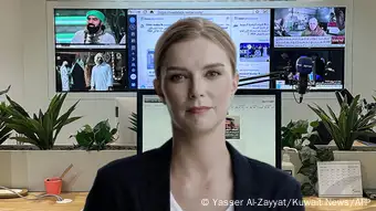 picture of an AI-generated news anchor, a woman with light-coloured hair, wearing a black jacket and white T-shirt