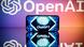 A cell phone showing the logo of ChatGPT, with OpenAI logo behind it A cell phone showing the logo of ChatGPT, with OpenAI logo behind it