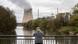 A man stands on a bridge looking at the Isar 2 nuclear plant A man stands on a bridge looking at the Isar 2 nuclear plant