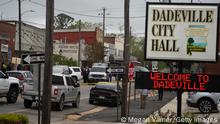 DADEVILLE, AL - APRIL 16: Community members watch as crime scene investigators work the scene of a shooting on April 16, 2023 in Dadeville, Alabama. According to reports, at least four people were killed and others injured in a shooting during a birthday party at a dance studio on Saturday night. (Photo by Megan Varner/Getty Images)