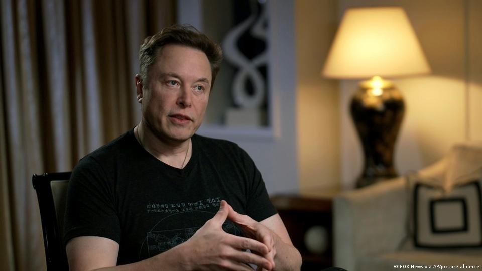 Elon Musk gestures as he is interviewed by FOX News host Tucker Carlson on Thursday, April 13, 2023