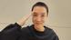 J-Hope pictured with a shaved head, saluting J-Hope pictured with a shaved head, saluting