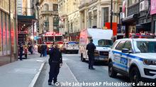 New York City Police and Fire Department personnel cordon off an area in New York's Financial District, Tuesday, April 18, 2023, near the site of a partially collapsed parking garage. It wasn't immediately clear whether anyone was injured. (AP Photo/Julie Jacobson)