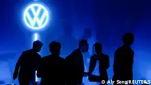 17.4.2023****People stand near the logo of Volkswagen as Volkswagen electric sedan ID.7 (not pictured) is debuted at an event ahead of the Shanghai Auto Show, in Shanghai, China April 17, 2023. REUTERS/Aly Song
