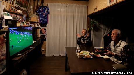Mutsuhiko Nomura with his wife Junko having dinner in front of the TV set