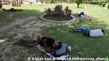 19.04.2023
People rest under the shade of trees to beat the intense heat in Lucknow in the the Indian state of Uttar Pradesh, Wednesday, April 19, 2023. Temperatures in India have become dangerously hot because of climate change. Heat wave in many parts of India are impacting human lives, with nearly a dozen dead and crops impacted. Amid the soaring temperature, schools in some parts of India have closed while some have changed their timings too. (AP Photo/Rajesh Kumar Singh)