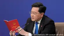 06/03/2023 FILE - Chinese Foreign Minister Qin Gang reads from the Chinese constitution when answering a question about Taiwan during a press conference held on the sidelines of the annual meeting of China's National People's Congress (NPC) in Beijing, on March 7, 2023. In the weeks since Chinese leader Xi Jinping won a third five-year term as president, setting him on course to remain in power for life, leaders and diplomats from around the world have beaten a path to his door. None more so than those from Europe. (AP Photo/Mark Schiefelbein, File)