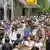 People crowd in a busy shopping street in Frankfurt, Germany