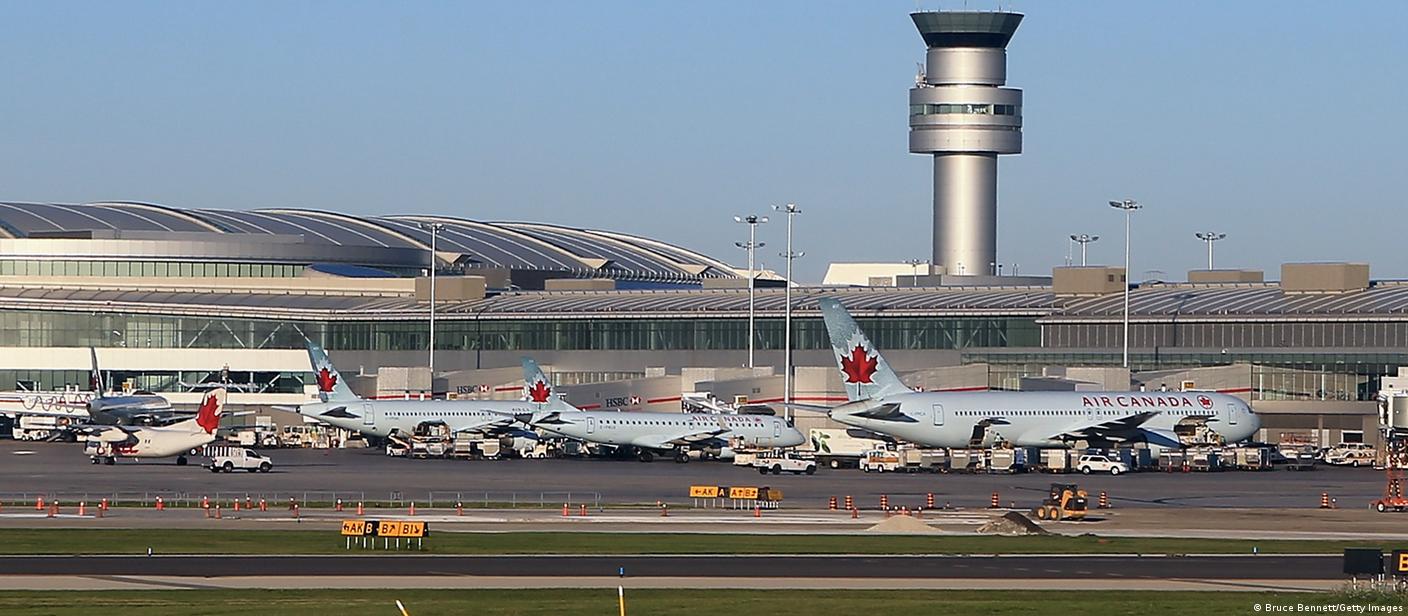 A view of Air Canada jets and the control tower at the Toronto Pearson International Airport