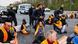 Activists are moved by police officers as they block a road in front of the Brandenburg Gate in Berlin, Germany Activists are moved by police officers as they block a road in front of the Brandenburg Gate in Berlin, Germany