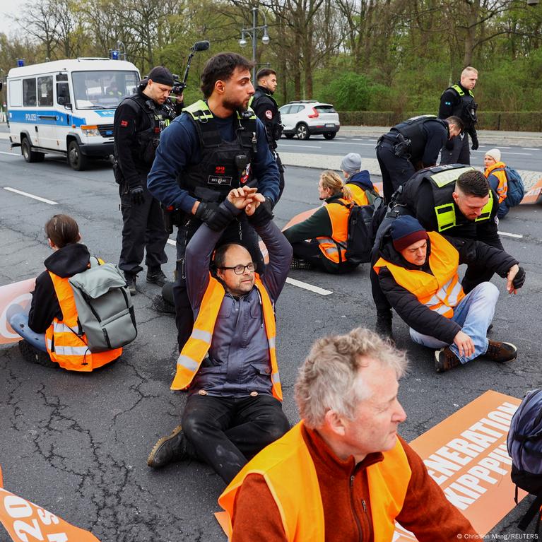 German police conduct raids on climate activists as impatience mounts