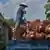  Palm oil farmer loading palm oil seeds onto a truck in Kampar, Riau province