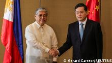 Chinese State Councilor and Foreign Minister Qin Gang and Philippine Foreign Affairs Secretary Enrique Manalo shake hands during the welcome ceremony prior to their bilateral meeting, in Manila, Philippines, April 22, 2023. Gerard Carreon/Pool via REUTERS