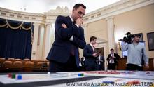 FILE PHOTO: Committee chairman U.S. Rep. Mike Gallagher (R-WI) looks over a map during a House Select Committee on the Strategic Competition Between the United States and the Chinese Communist Party meeting on Taiwan Tabletop Exercise (TTX), a war games simulation, on Capitol Hill in Washington, U.S., April 19, 2023. REUTERS/Amanda Andrade Rhoades/File Photo