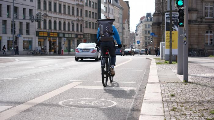 A cyclist uses a bike lane on a highway in Leipzig, Germany A cyclist uses a bike lane on a highway in Leipzig, Germany