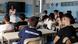 Teenage students sit in a classroom in Rome listening to a female teacher Teenage students sit in a classroom in Rome listening to a female teacher