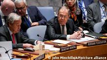 Russia's foreign minister Sergey Lavrov, serving as the president of the Security Council, listens as Antonio Guterres, United Nations Secretary General, left, speaks during a meeting of the U.N. Security Council, Monday, April 24, 2023, at United Nations headquarters. (AP Photo/John Minchillo)