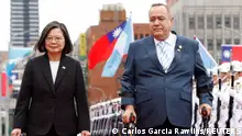 Taiwan's President Tsai Ing-wen walks next to Guatemala's President Alejandro Giammattei during his welcome ceremony in front of the Presidential building in Taipei, Taiwan April 25, 2023. REUTERS/Carlos Garcia Rawlins