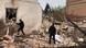 Police officers scale ruble and ruins following the attack on Kupiansk Police officers scale ruble and ruins following the attack on Kupiansk