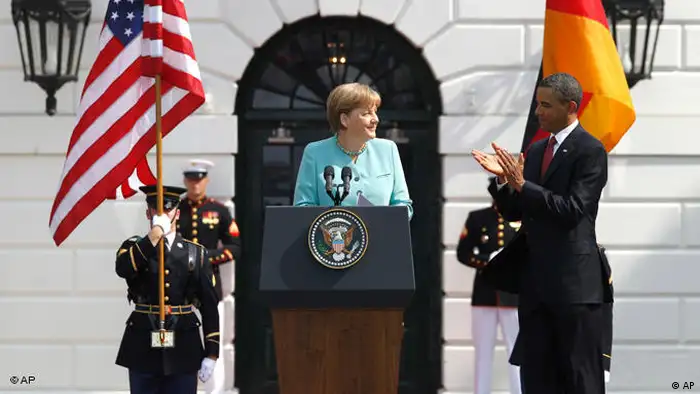 US President Barack Obama bestows Chancellor Angela Merkel the Presidential Medal of Freedom in front of the White House.
(Photo: AP Photo/Charles Dharapak) 