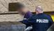 The 26-year-old man being escorted by police during his arrest The 26-year-old man being escorted by police during his arrest