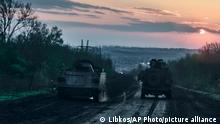 26/04/2023 **Ukrainian APCs on the road to Bakhmut, the site of the heaviest battles with the Russian troops in the Donetsk region, Ukraine, Wednesday, April 26, 2023. (AP Photo/Libkos)