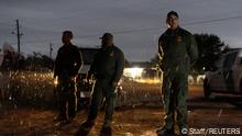 April 2023****
Border Patrol agents stand guard over migrants from China as they wait for transportation for the migrants in Fronton, Texas, U.S., April 5, 2023. Apprehensions of Chinese nationals at the U.S.-Mexico border reached more than 6,500 in the six months since October 2022, the highest on record and a more than 15-fold increase over the same period a year ago, according to U.S. Customs and Border Protection (CBP) data. While just a sliver of the hundreds of thousands of migrants arriving at the southwest border, Chinese people were the fastest growing demographic in those six months, CBP data show. REUTERS/Staff SEARCH U.S. CHINA MIGRATION FOR THIS STORY. SEARCH WIDER IMAGE FOR ALL STORIES.