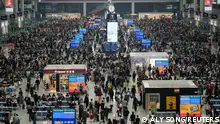 Passengers wait to board trains at Shanghai Hongqiao railway station ahead of the five-day Labour Day holiday, in Shanghai, China, April 28, 2023. REUTERS/Aly Song