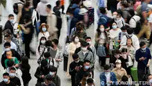 Passengers wait to board trains at Shanghai Hongqiao railway station ahead of the five-day Labour Day holiday, in Shanghai, China, April 28, 2023. REUTERS/Aly Song