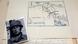 A detailed view of the collection of information including photos, letters, statements and the map accompanied by a photo of a German soldier