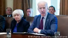 President Joe Biden speaks during a cabinet meeting in the Cabinet Room of the White House, Thursday, March 3, 2022, in Washington, as Treasury Secretary Janet Yellen listens. (AP Photo/Patrick Semansky)