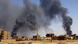 Smoke rises above buildings after aerial bombardment in Khartoum North, Sudan Smoke rises above buildings after aerial bombardment in Khartoum North, Sudan