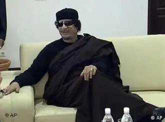 In this image taken from video on Sunday, June 12, 2011, provided by FIDE President Kirsan Ilyumzhinov's press service, Libyan leader Moammar Gadhafi, next to visiting president of the World Chess Federation Kirsan Ilyumzhinov, not in photo, before a game of chess in Tripoli, the capital of Libya. As the world awaits Moammar Gadhafi's next move, the Libyan leader has been playing chess with the visiting Russian head of the World Chess Federation. The federation is headed by the eccentric Kirsan Ilyumzhinov, who until last year was the leader of Russia's predominantly Buddhist republic of Kalmykia. He once claimed to have visited an alien spaceship. (Foto:FIDE Press service/AP/dapd) EDITORIAL USE ONLY