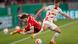 SC Freiburg's Lukas Kuebler in action with RB Leipzig's Dani Olmo SC Freiburg's Lukas Kuebler in action with RB Leipzig's Dani Olmo
