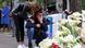 People react as they pay tribute following a school mass shooting in Belgrade, Serbia People react as they pay tribute following a school mass shooting in Belgrade, Serbia