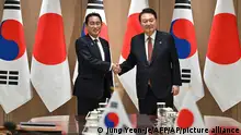 07/05/2023 South Korean President Yoon Suk Yeol, right, shakes hands with Japanese Prime Minister Fumio Kishida during their meeting at the presidential office in Seoul Sunday, May 7, 2023. The leaders of South Korea and Japan met Sunday for their second summit in less than two months, as they push to mend long-running historical grievances and boost ties in the face of North Korea’s nuclear program and other regional challenges. (Jung Yeon-je/Pool Photo via AP)