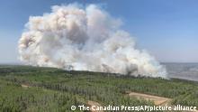 In this photo provided by the Government of Alberta Fire Service, a wildfire burns a section of forest in the Grande Prairie district of Alberta, Canada, Saturday, May 6, 2023. (Government of Alberta Fire Service/The Canadian Press via AP)