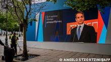 06/05/2023 Greek Prime Minister Kyriakos Mitsotakis is seen on a display video wall, at the campaign kiosk of the New Democracy party ahead of the upcoming parliamentary elections in Athens on May 6, 2023. - Greece holds its most unpredictable election in over a decade on May 21. It is expected to be a close contest between the conservative New Democracy of outgoing Prime Minister and the left-wing Syriza of former premier. (Photo by Angelos Tzortzinis / AFP)