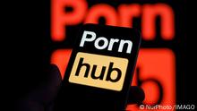 Pornhub To Battle Illegal Activity With Child Abuse Charities The Pornhub logo is seen on an iPhone mobile device in this illustration photo in Warsaw, Poland on 12 October, 2022. The world s largest website will monitor more than 28 thousand keywords that may signal illegal activity together with the help of child abuse charity organizations. Warsaw Poland PUBLICATIONxNOTxINxFRA Copyright: xSTRx originalFilename: arriens-pornhubt221012_np6FO.jpg