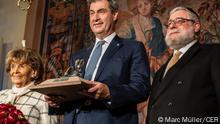 Markus Söder (center), Charlotte Knobloch, Pinchas Goldschmidt